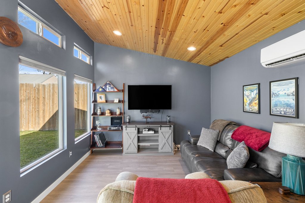 1720 Prather Street Taylor, TX 76574 - Photo 30 of 34 a living room with furniture and a flat screen tv