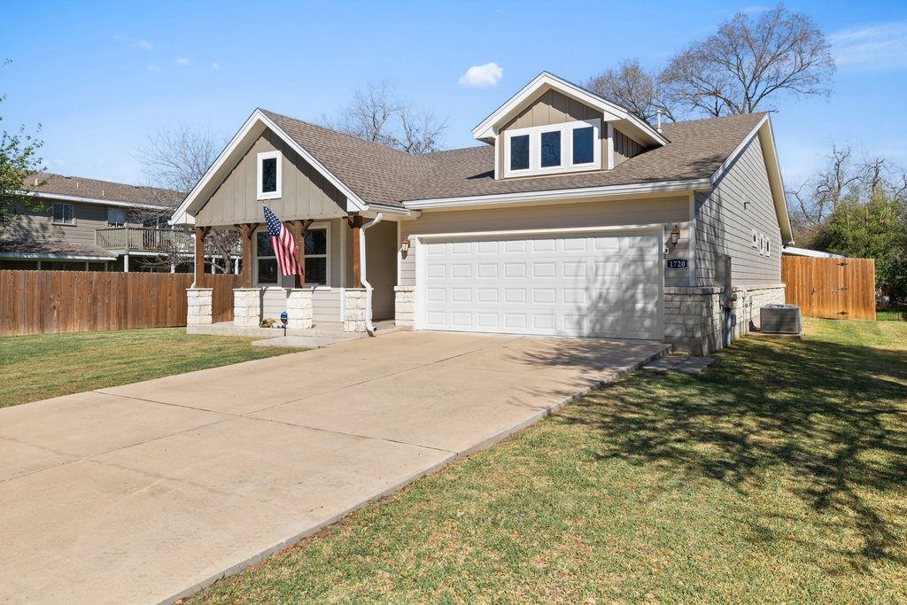 1720 Prather Street Taylor, TX 76574 - Photo 3 of 34 a front view of a house with a yard