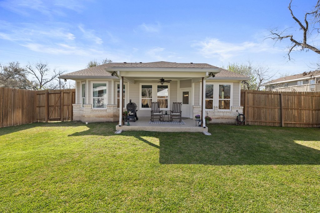 1720 Prather Street Taylor, TX 76574 - Photo 32 of 34 a view of a house with a backyard porch and sitting area