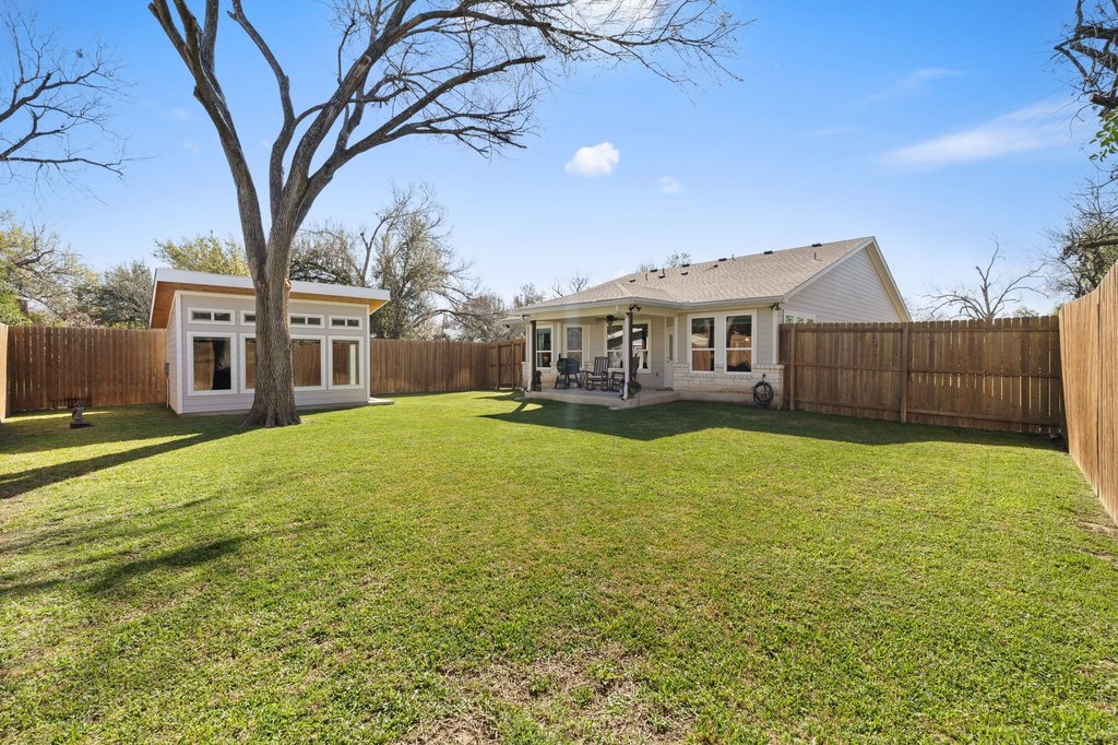 1720 Prather Street Taylor, TX 76574 - Photo 33 of 34 a view of a house with a yard
