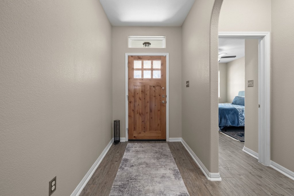 1720 Prather Street Taylor, TX 76574 - Photo 5 of 34 a view of a bathroom from a hallway