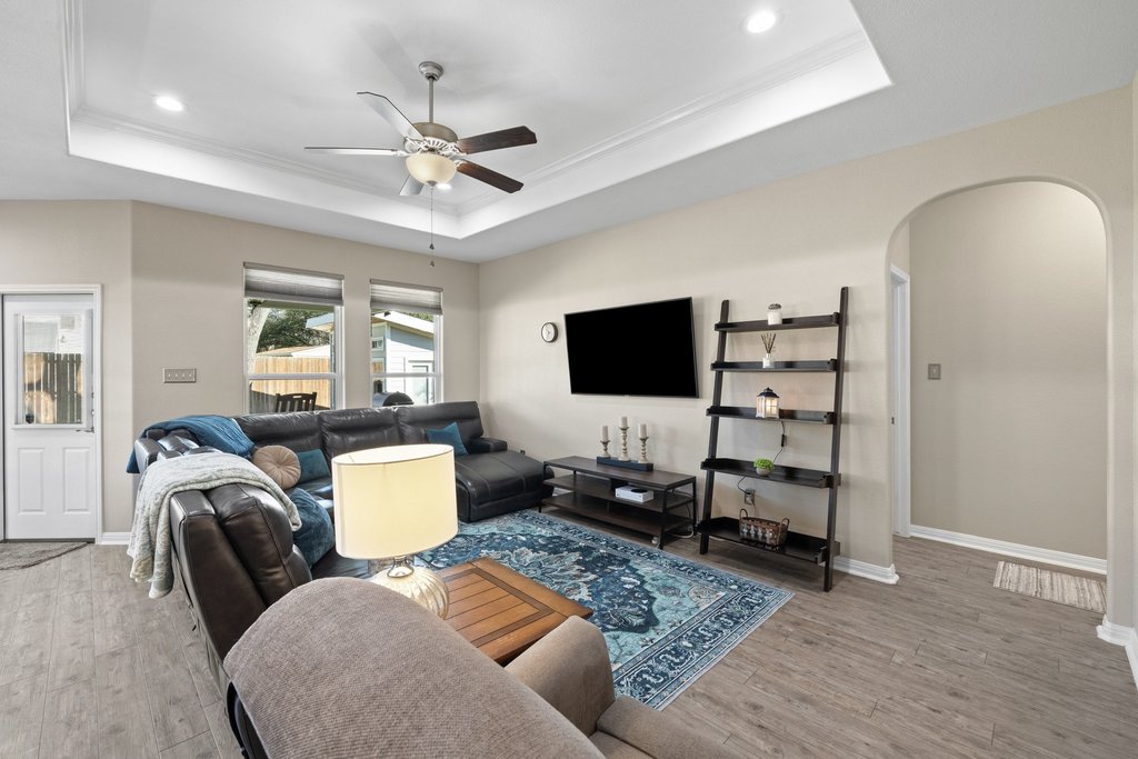 1720 Prather Street Taylor, TX 76574 - Photo 6 of 34 a living room with furniture and a flat screen tv