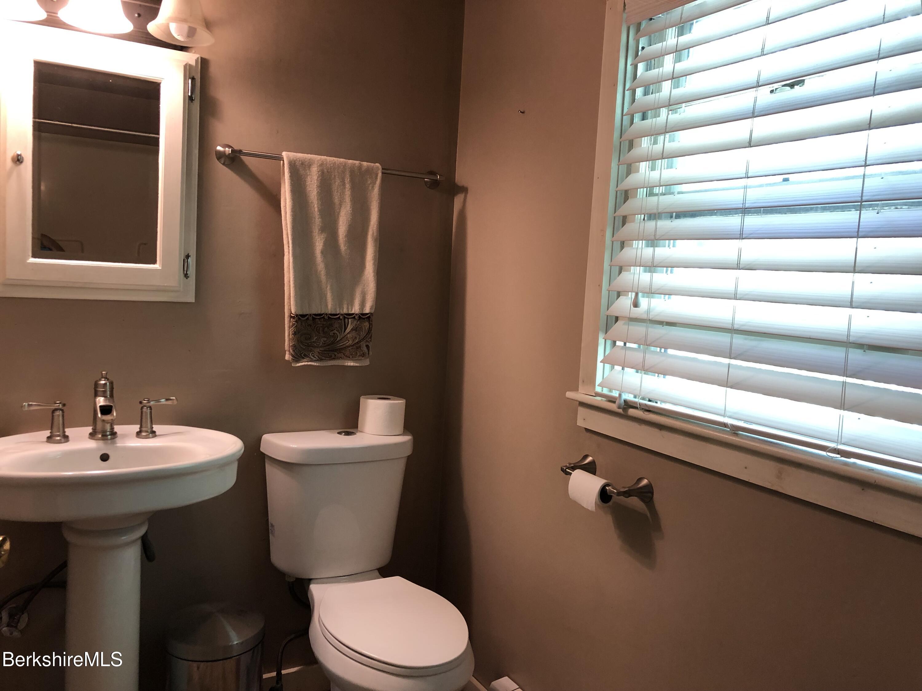 2959 Hancock Road Hancock, MA 01267 - Photo 14 of 55 a bathroom with a sink mirror and toilet