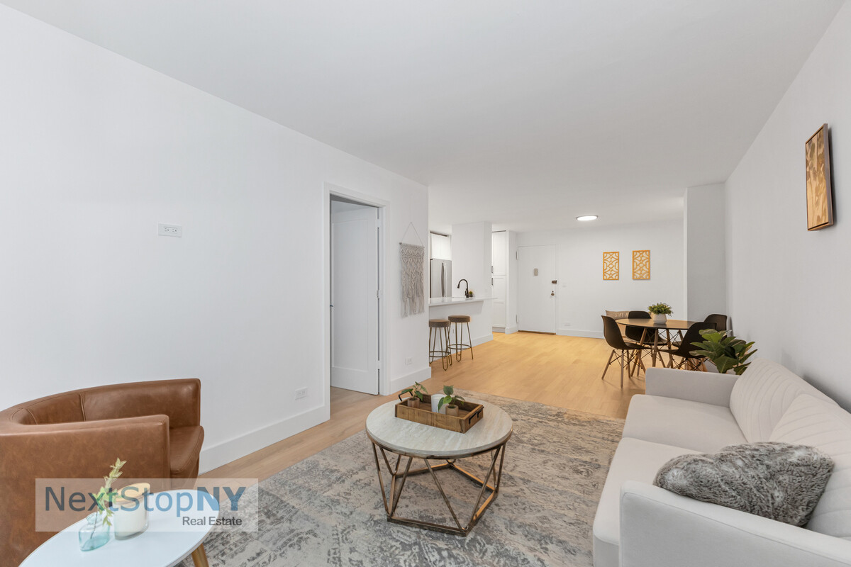 363 East 76th Street, Unit 2L Manhattan, NY 10021 - Photo 5 of 10 a living room with furniture and a dining table