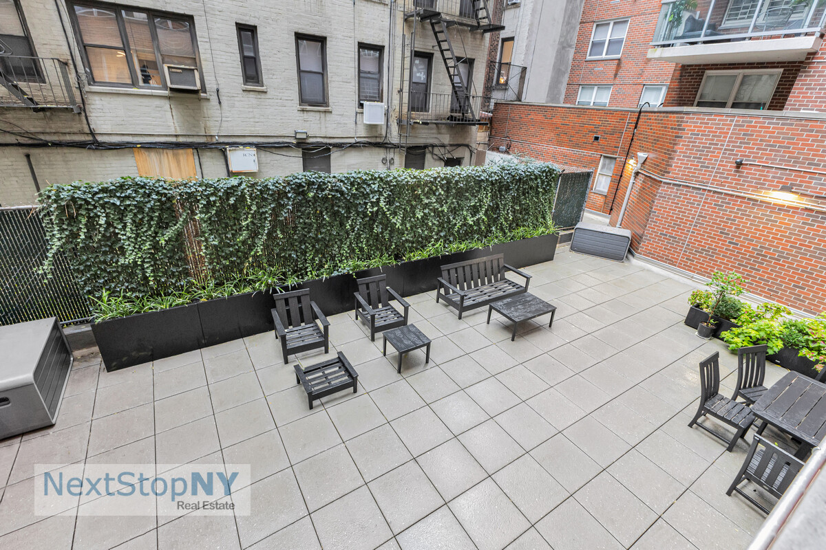 363 East 76th Street, Unit 2L Manhattan, NY 10021 - Photo 9 of 10 a view of a patio with table and chairs potted plants