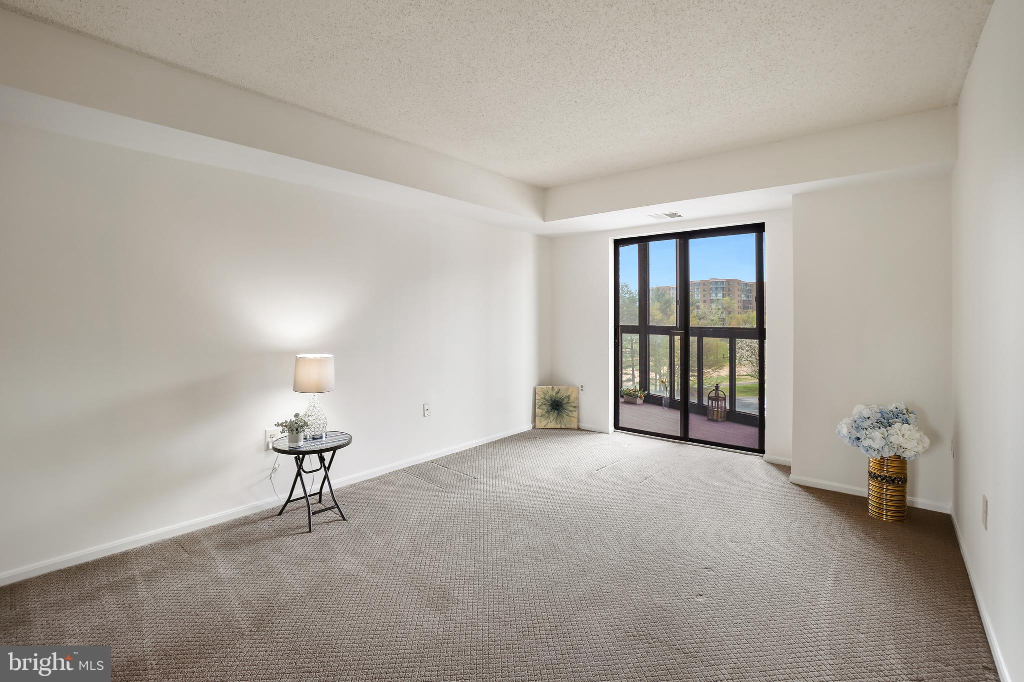 15100 Interlachen Drive, Unit 4517 Silver Spring, MD 20906 - Photo 20 of 42 a view of an empty room with a window