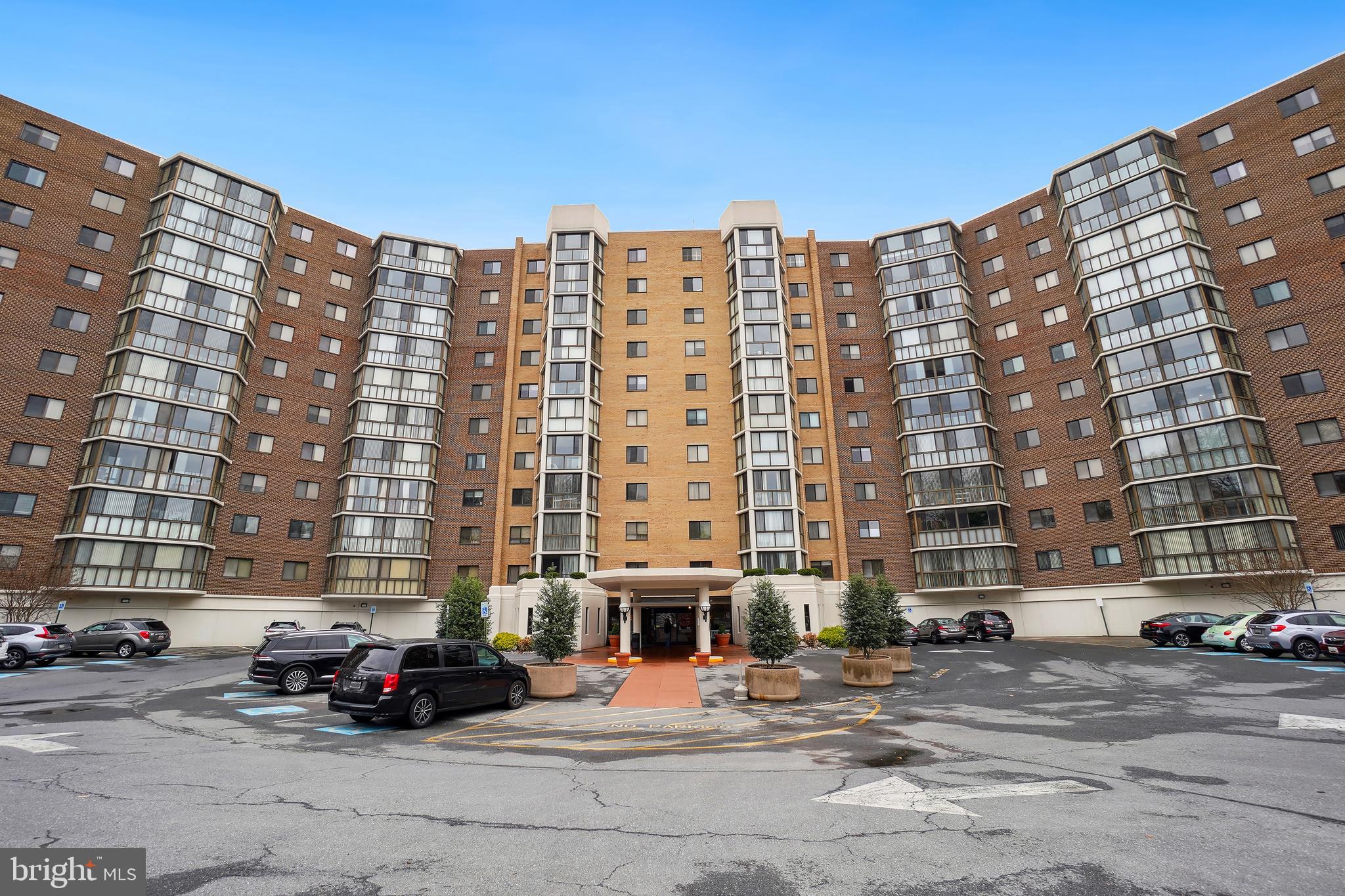 15100 Interlachen Drive, Unit 4517 Silver Spring, MD 20906 - Photo 27 of 42 a car parked in front of a tall building