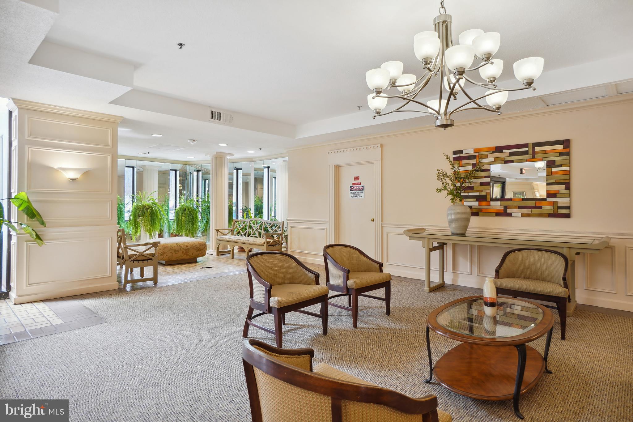 15100 Interlachen Drive, Unit 4517 Silver Spring, MD 20906 - Photo 28 of 42 a view of a dining room with furniture and chandelier