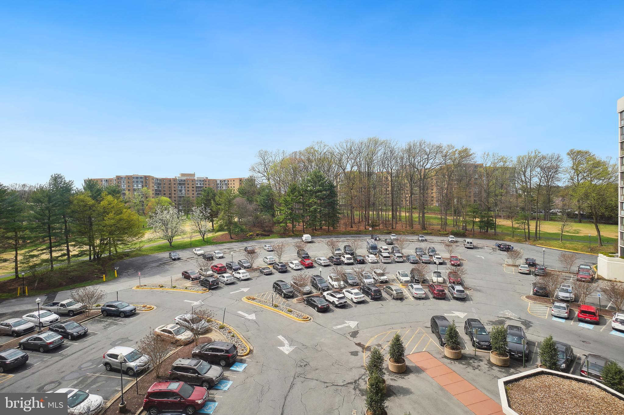 15100 Interlachen Drive, Unit 4517 Silver Spring, MD 20906 - Photo 30 of 42 a view of a lake with a car parked on the roadside