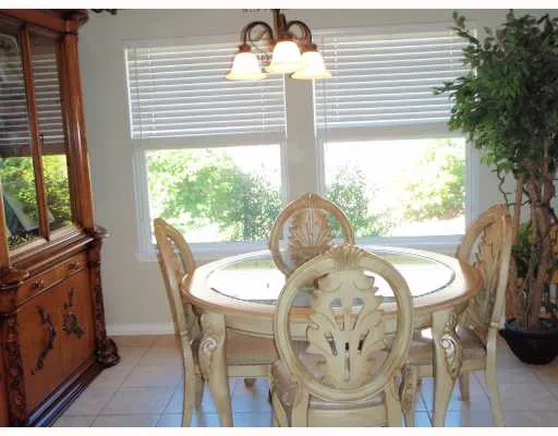 a front view of a dining room with furniture window and outside view