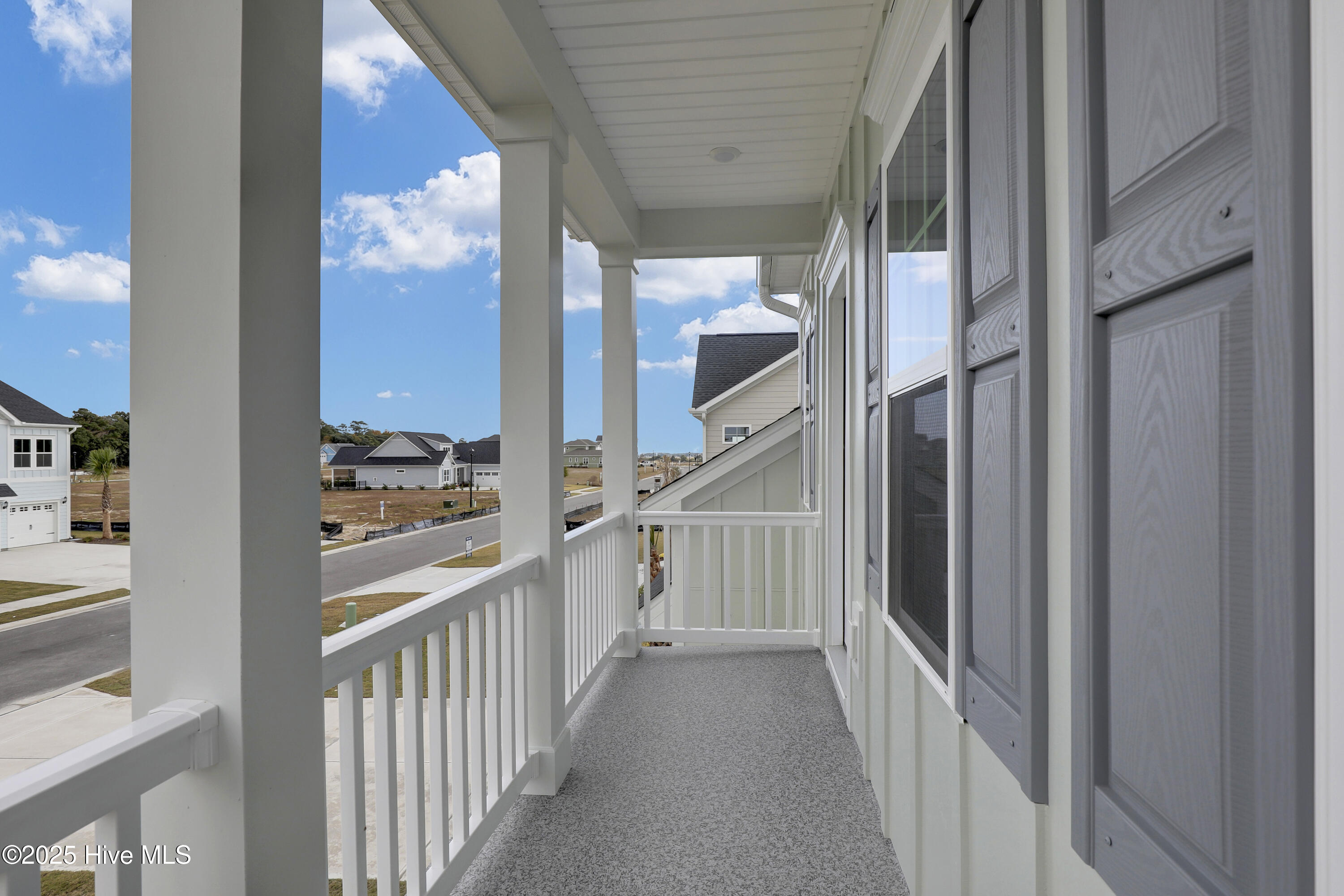 230 Planters Walk Hampstead, NC 28443 - Photo 21 of 39 Primary Suite Balcony