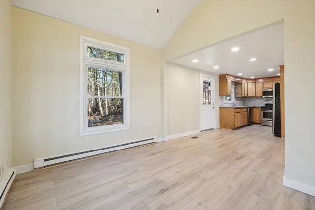 a view of a kitchen with a sink and a window