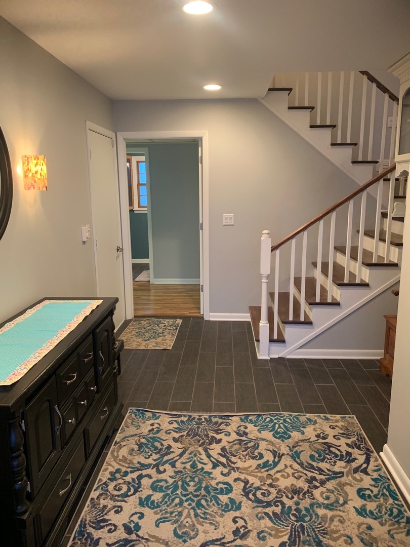 4473 East 250th Road Mendota, IL 61342 - Photo 3 of 15 a view of a hallway with wooden floor and stairs