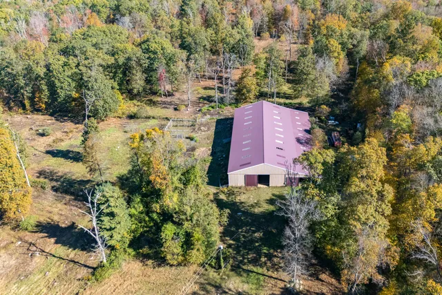 a aerial view of a house with a yard