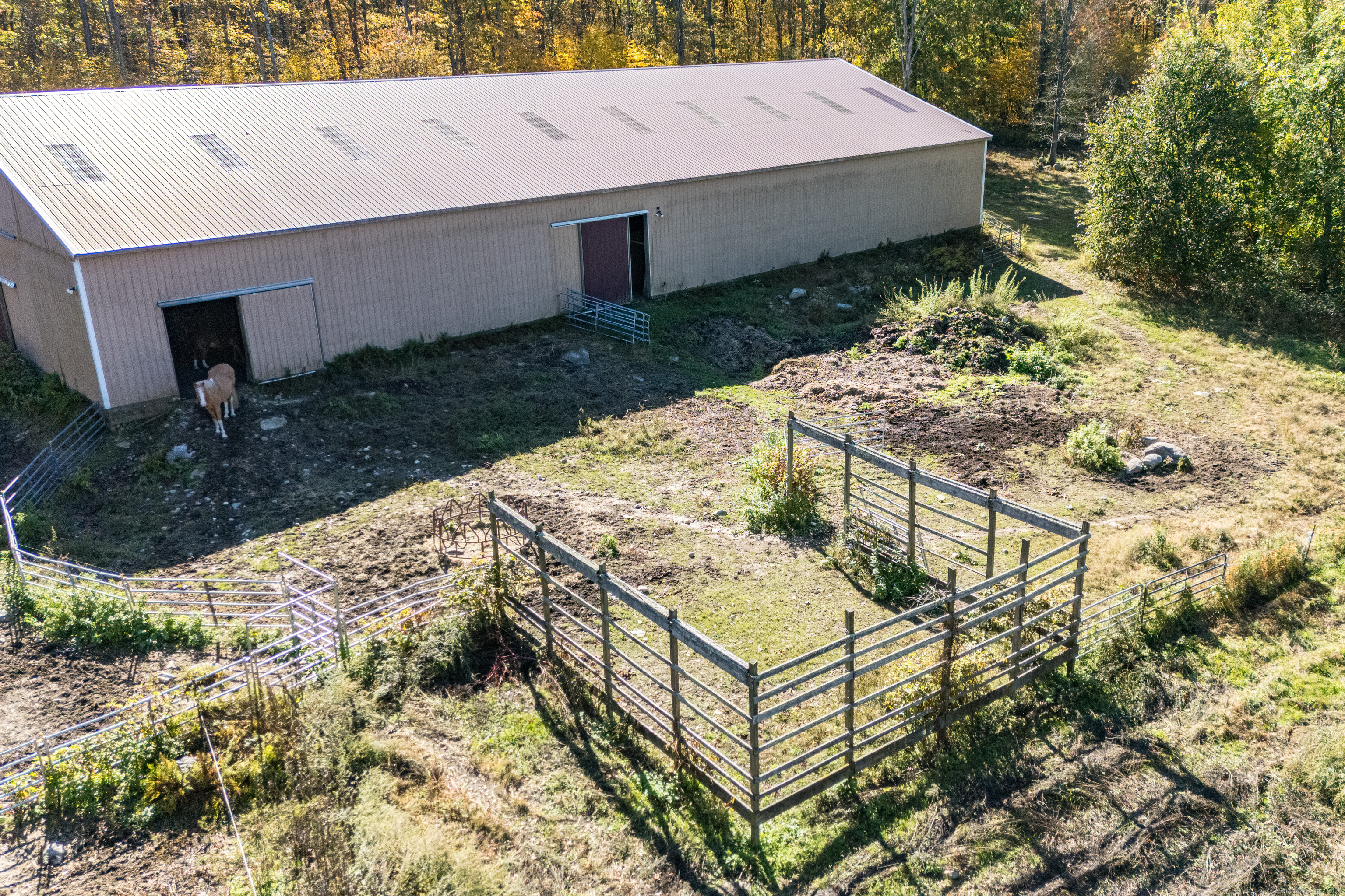 Undisclosed Address Windham, CT 06256 - Photo 14 of 39 a view of a backyard with chairs and wooden fence