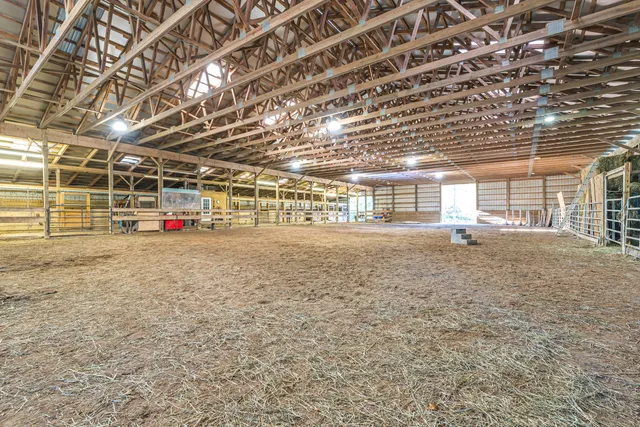 a view of an empty room with wooden walls