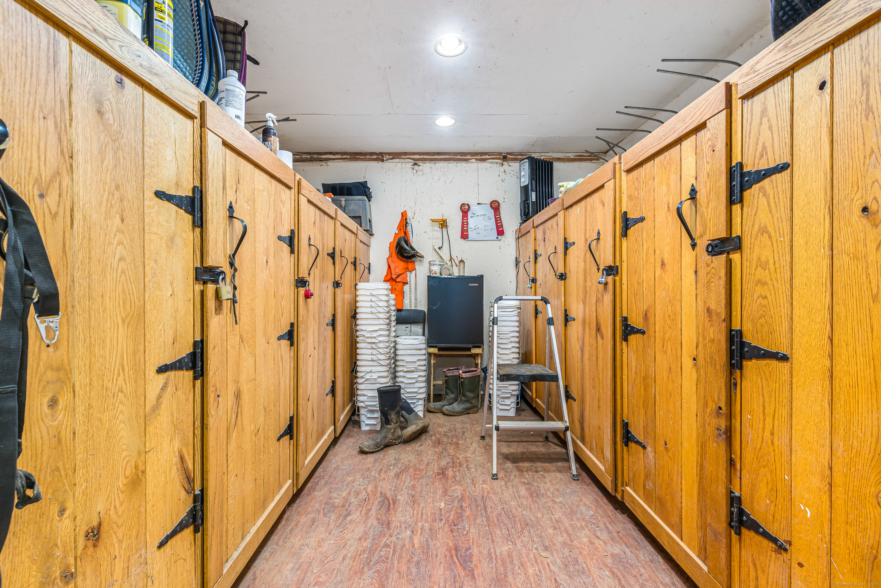 Undisclosed Address Windham, CT 06256 - Photo 23 of 39 a view of an entryway with wooden floor and stairs