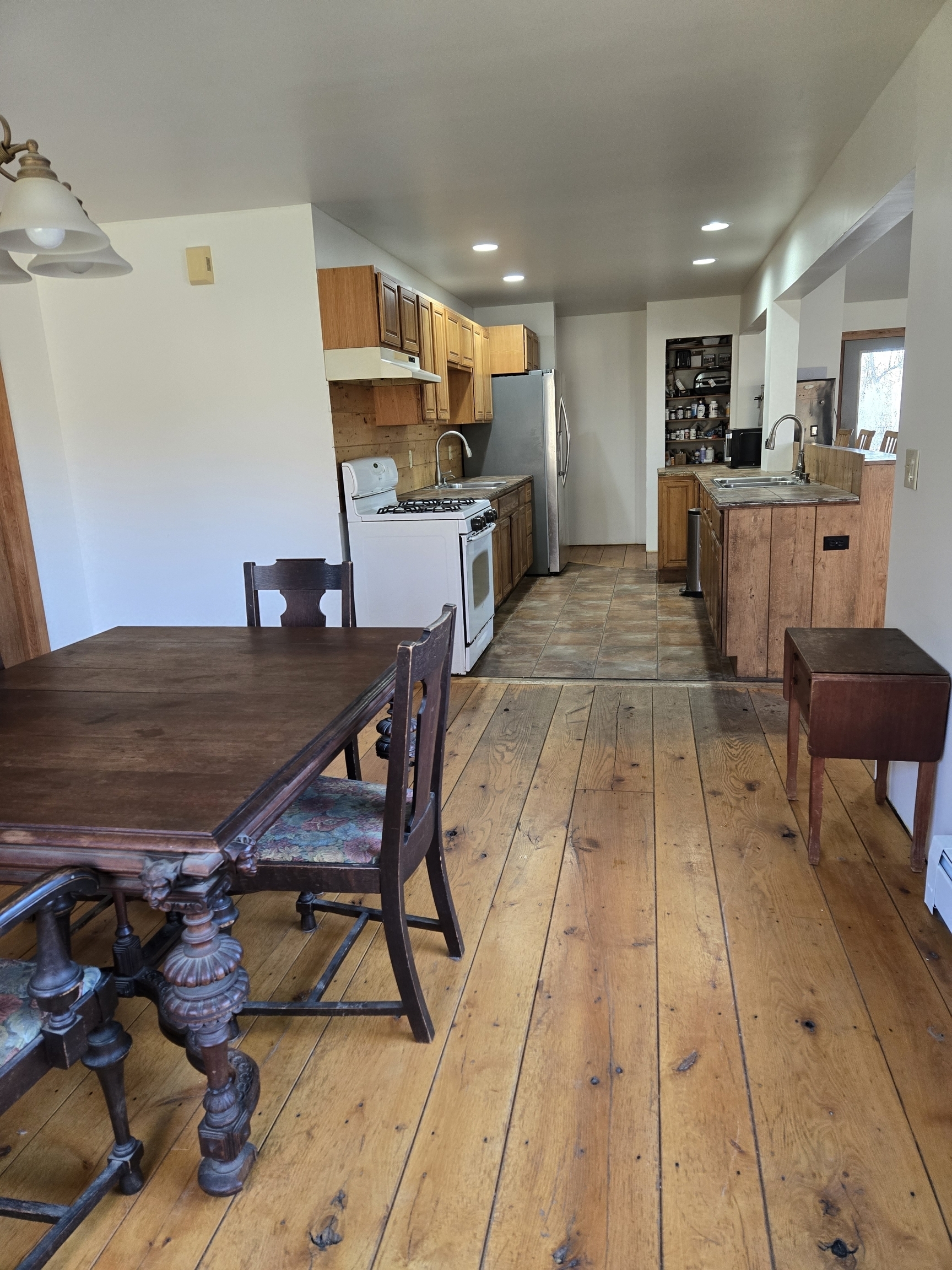 Undisclosed Address Windham, CT 06256 - Photo 31 of 39 a view of kitchen with cabinets and wooden floor