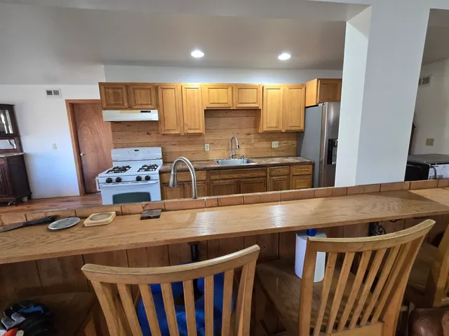 a view of a dining room with furniture and window