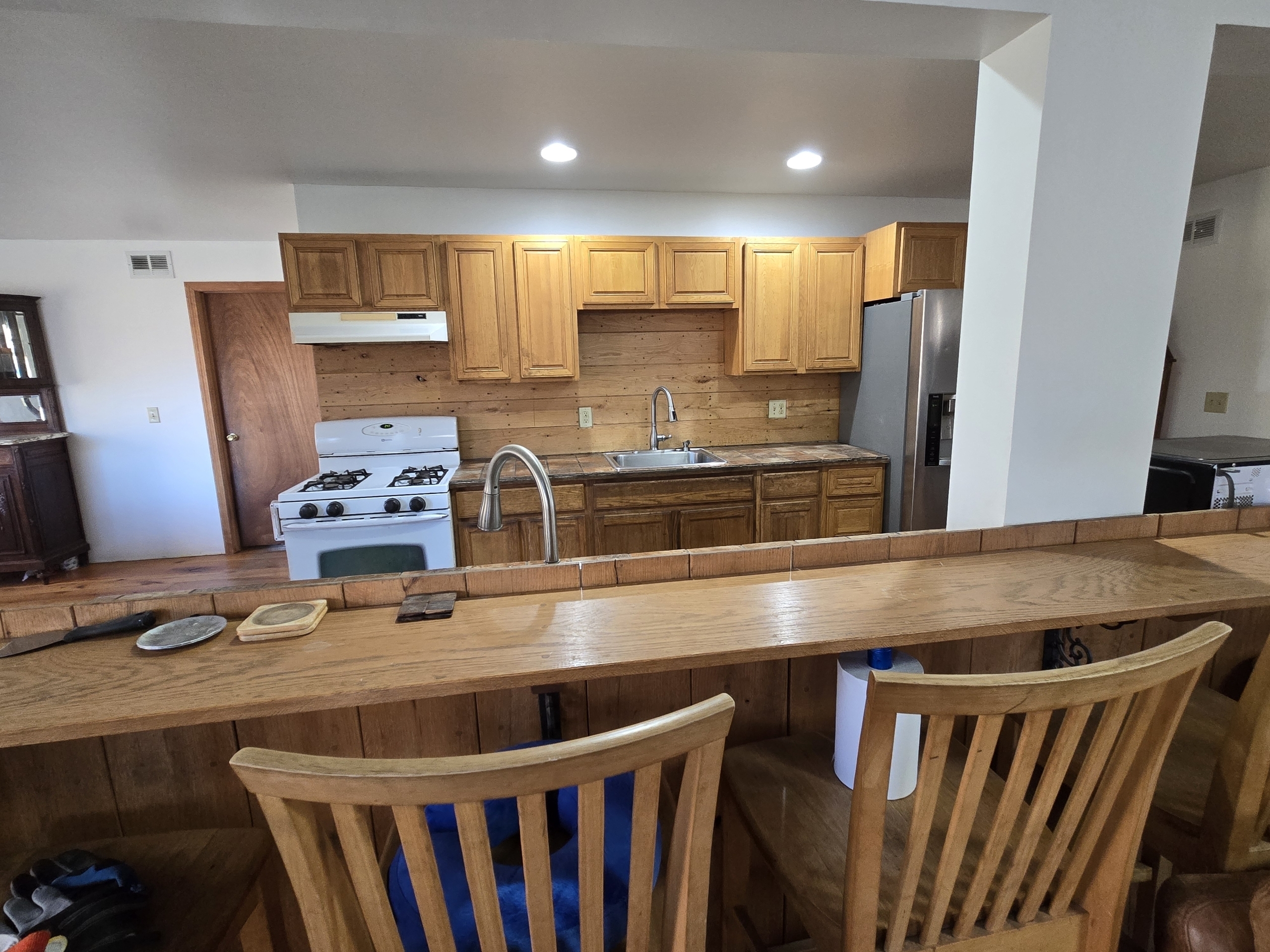 Undisclosed Address Windham, CT 06256 - Photo 32 of 39 a kitchen with kitchen island granite countertop a sink and refrigerator