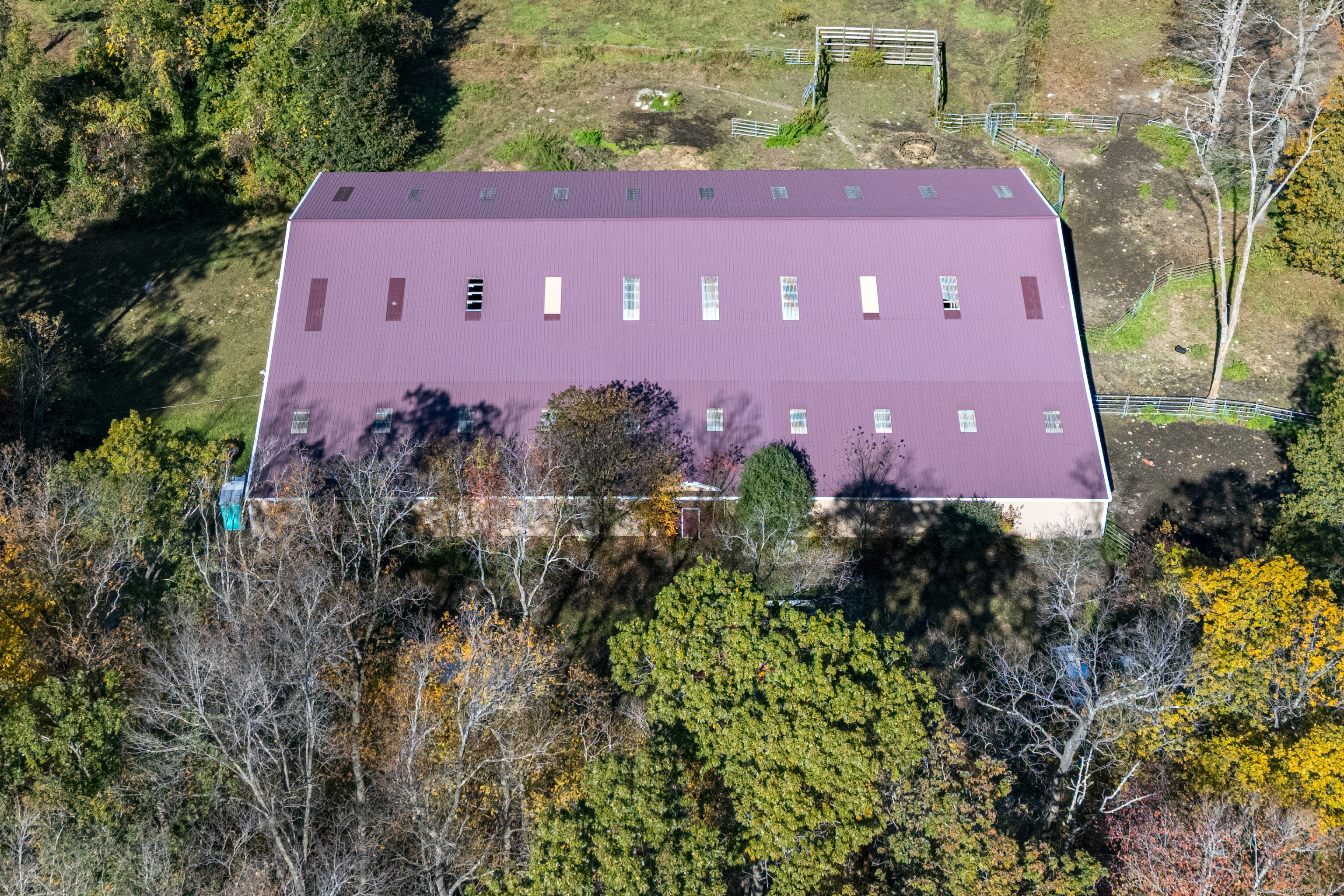 Undisclosed Address Windham, CT 06256 - Photo 10 of 39 a view of a building with a yard and a large tree