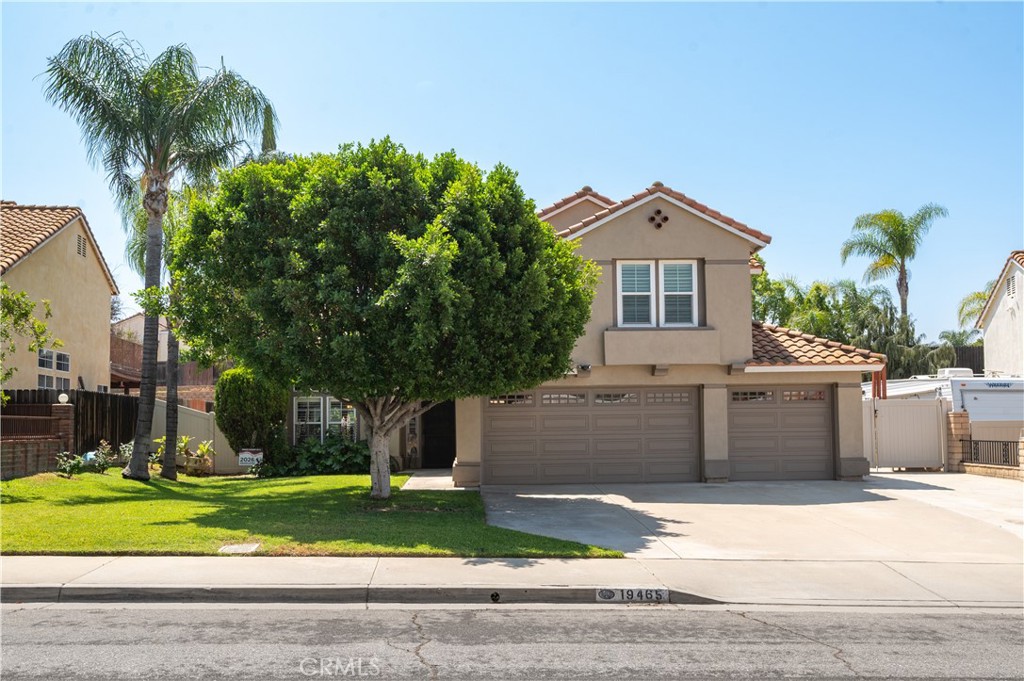 19465 Kinnow Lane Riverside, CA 92508 - Photo 2 of 61 a front view of a house with a yard and garage