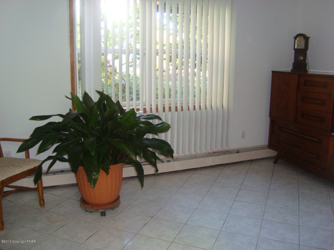 2024 Romeo Road Tobyhanna, PA 18466 - Photo 8 of 8 a potted plant sitting in front of a window