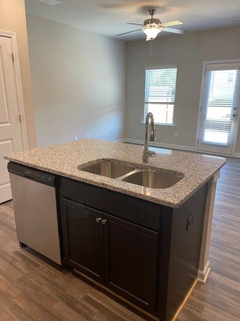 585 McWilliams Road Southeast, Unit 707 Atlanta, GA 30315 - Photo 3 of 10 a kitchen with granite countertop a sink and a window