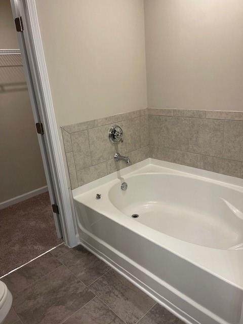 585 McWilliams Road Southeast, Unit 707 Atlanta, GA 30315 - Photo 8 of 10 a spacious bathroom with a bathtub and shower