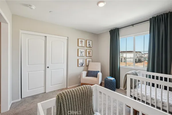 a bedroom with furniture and a window