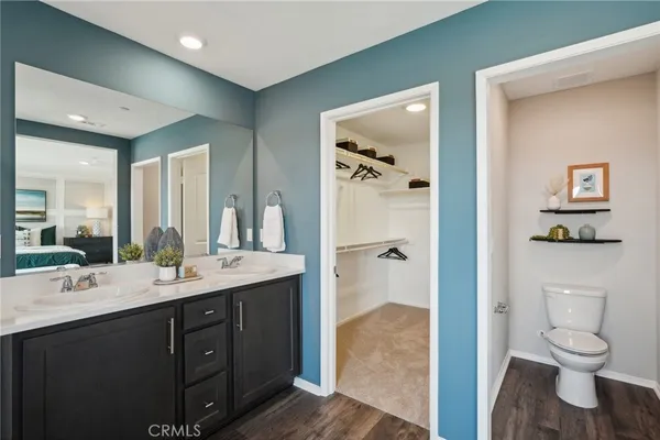 a bathroom with a double vanity sink mirror and shower