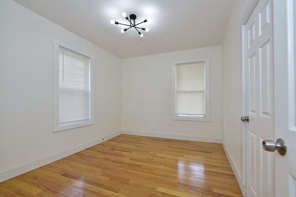 24 Rector Road, Unit 2 Boston, MA 02126 - Photo 11 of 17 a view of room with a ceiling fan and window
