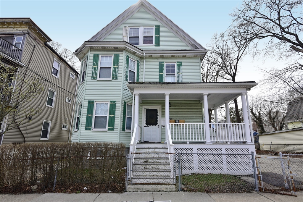 24 Rector Road, Unit 2 Boston, MA 02126 - Photo 15 of 17 a front view of a house with a yard