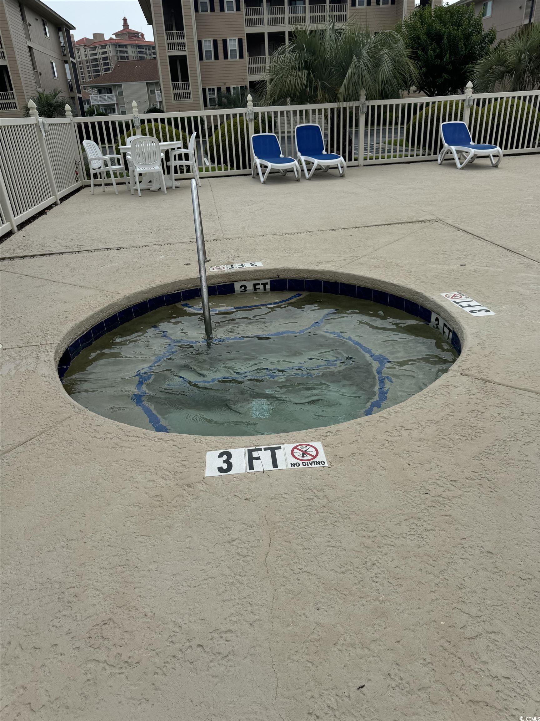 1900 Duffy Street, Unit J4 North Myrtle Beach, SC 29582 - Photo 21 of 22 View of pool featuring a hot tub