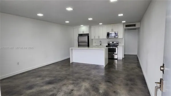 a view of a kitchen with a sink