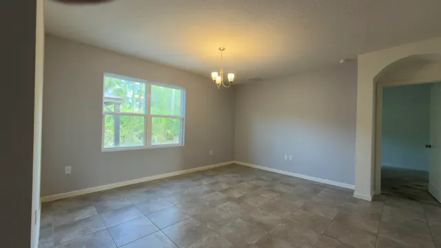 a view of yard with patio