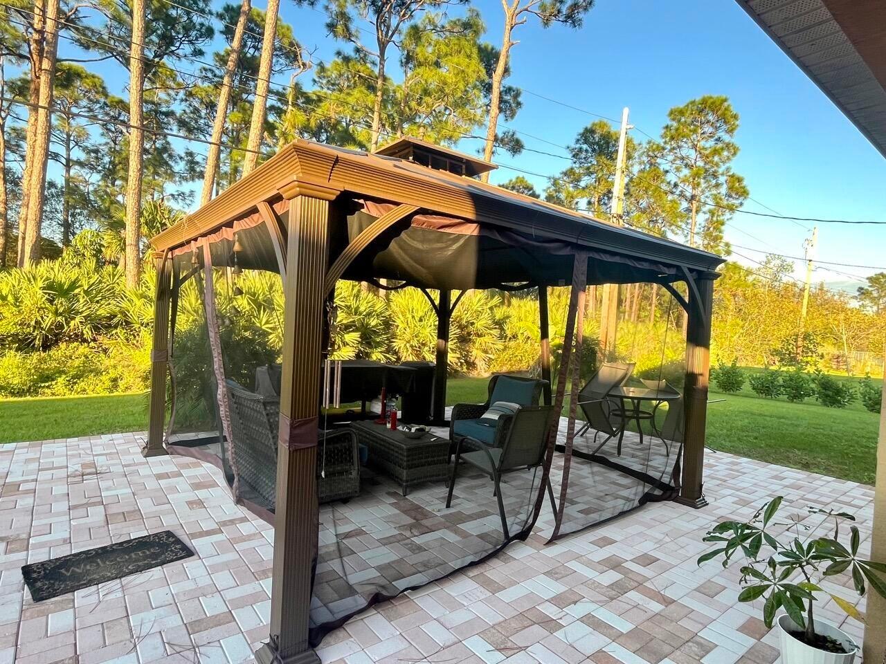 1117 Southwest Goodman Avenue Port St. Lucie, FL 34953 - Photo 14 of 18 a view of an outdoor sitting space