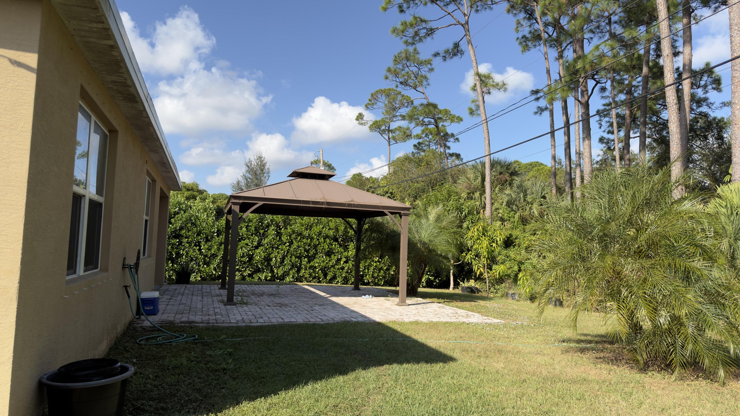 1117 Southwest Goodman Avenue Port St. Lucie, FL 34953 - Photo 16 of 18 a view of a back yard of the house