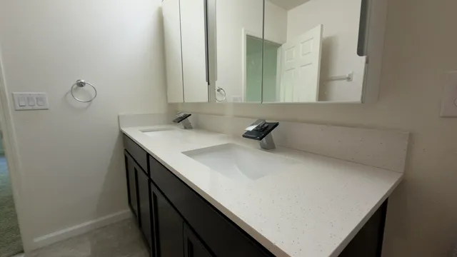 a bathroom with a sink and mirror