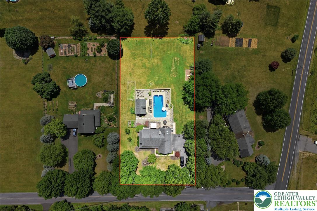 890 Lahr Road Nazareth, PA 18064 - Photo 4 of 71 An aerial perspective reveals a spacious estate with a private pool and well-maintained grounds.