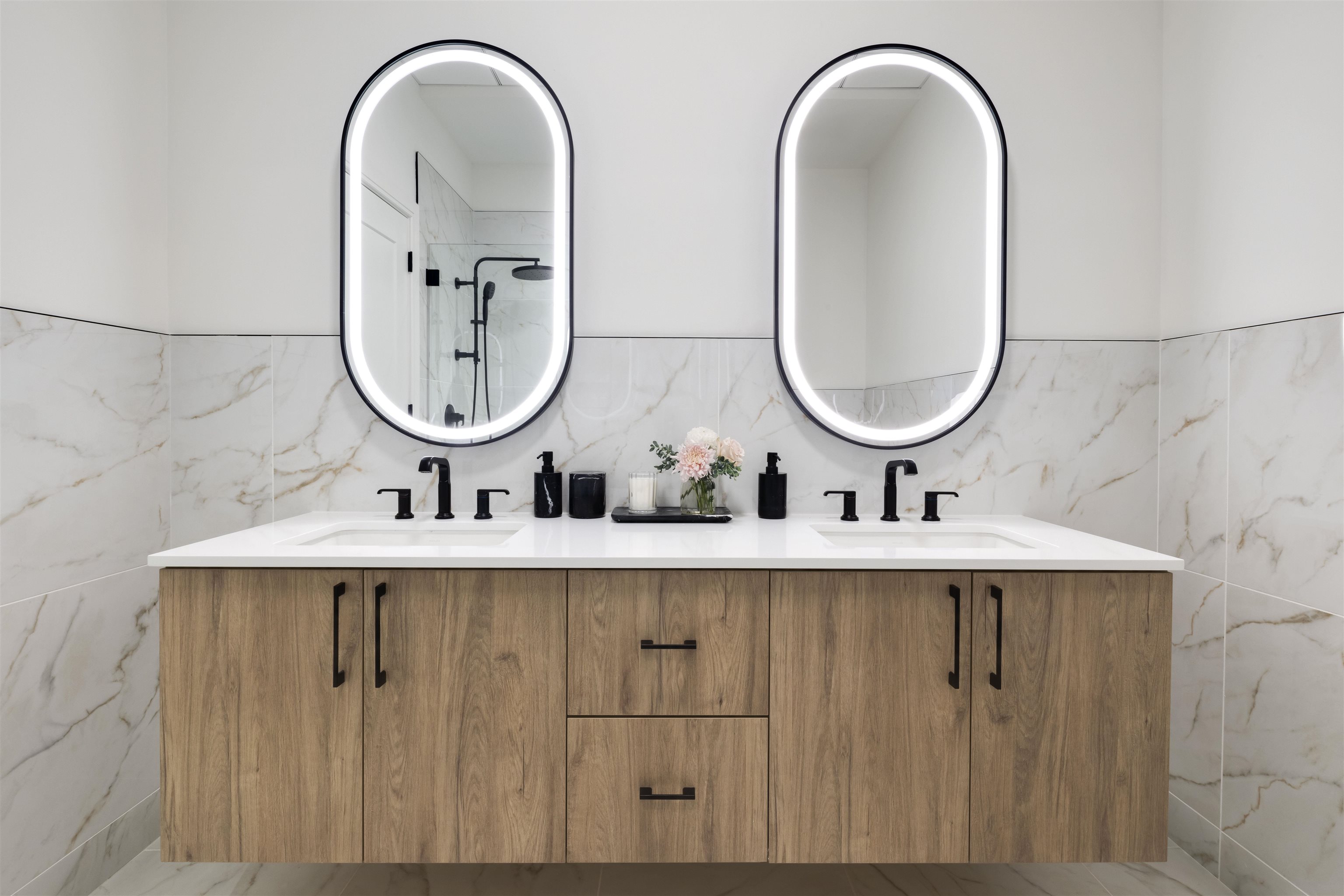 38 Jackson Street, Unit 313 Hoboken, NJ 07030 - Photo 5 of 20 a bathroom with double vanity sinks and a mirror