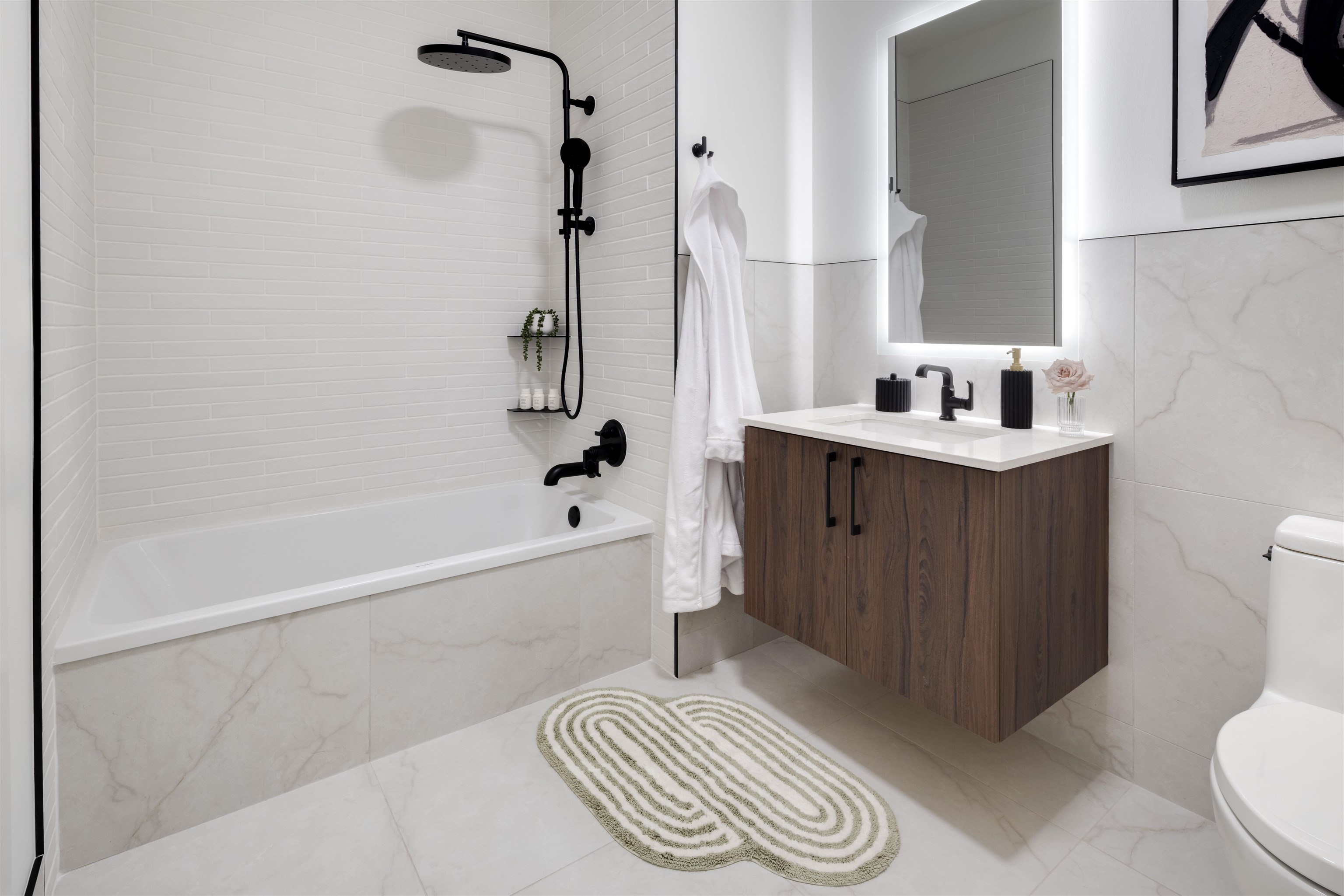 38 Jackson Street, Unit 313 Hoboken, NJ 07030 - Photo 8 of 20 a bathroom with a sink a toilet and shower