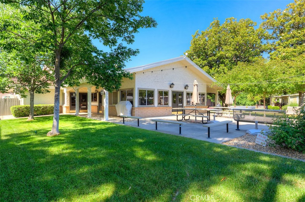 1901 Dayton Road, Unit 133 Chico, CA 95928 - Photo 31 of 36 a view of a house with a backyard and a patio