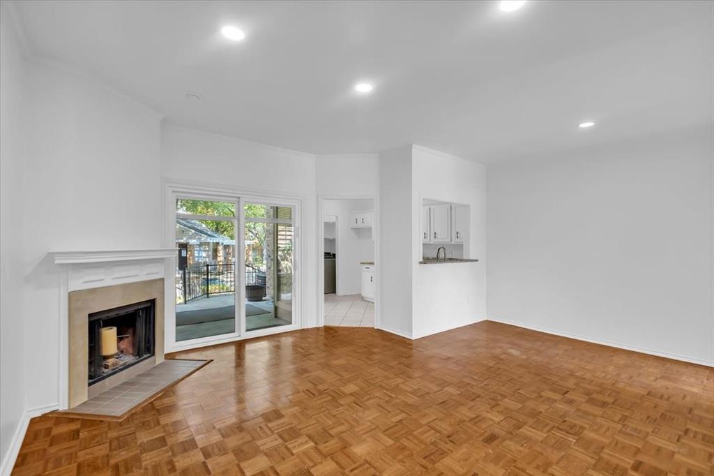 14277 Preston Road, Unit C315 Dallas, TX 75254 - Photo 3 of 26 Living room with patio view to pool