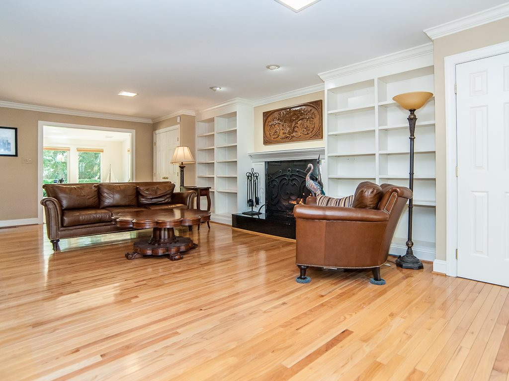6920 Slade Hill Road Raleigh, NC 27615 - Photo 6 of 30 Large living room with fireplace and built-ins Living Room