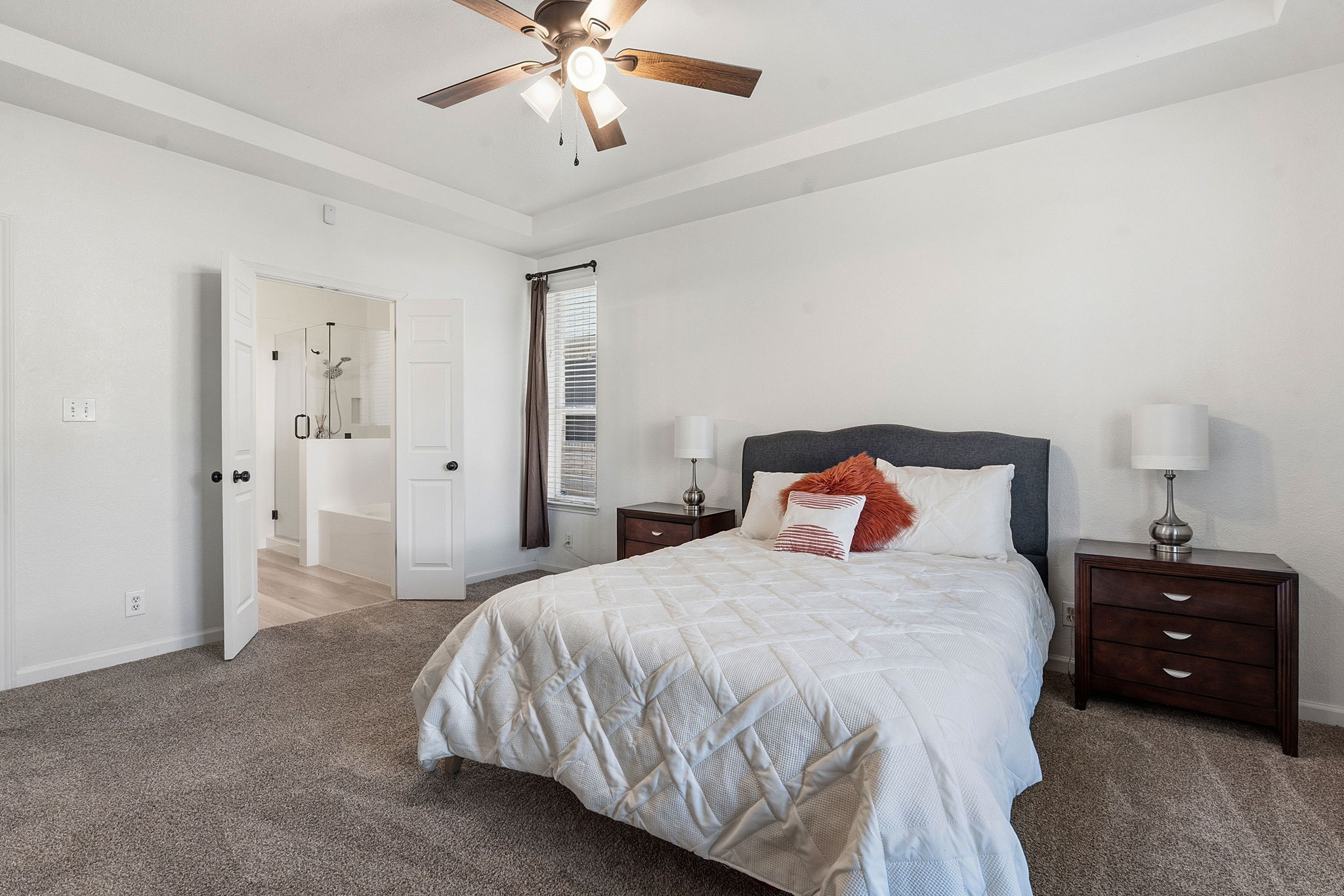 12716 Withers Way Austin, TX 78727 - Photo 14 of 29 a bedroom with a bed and a lamp
