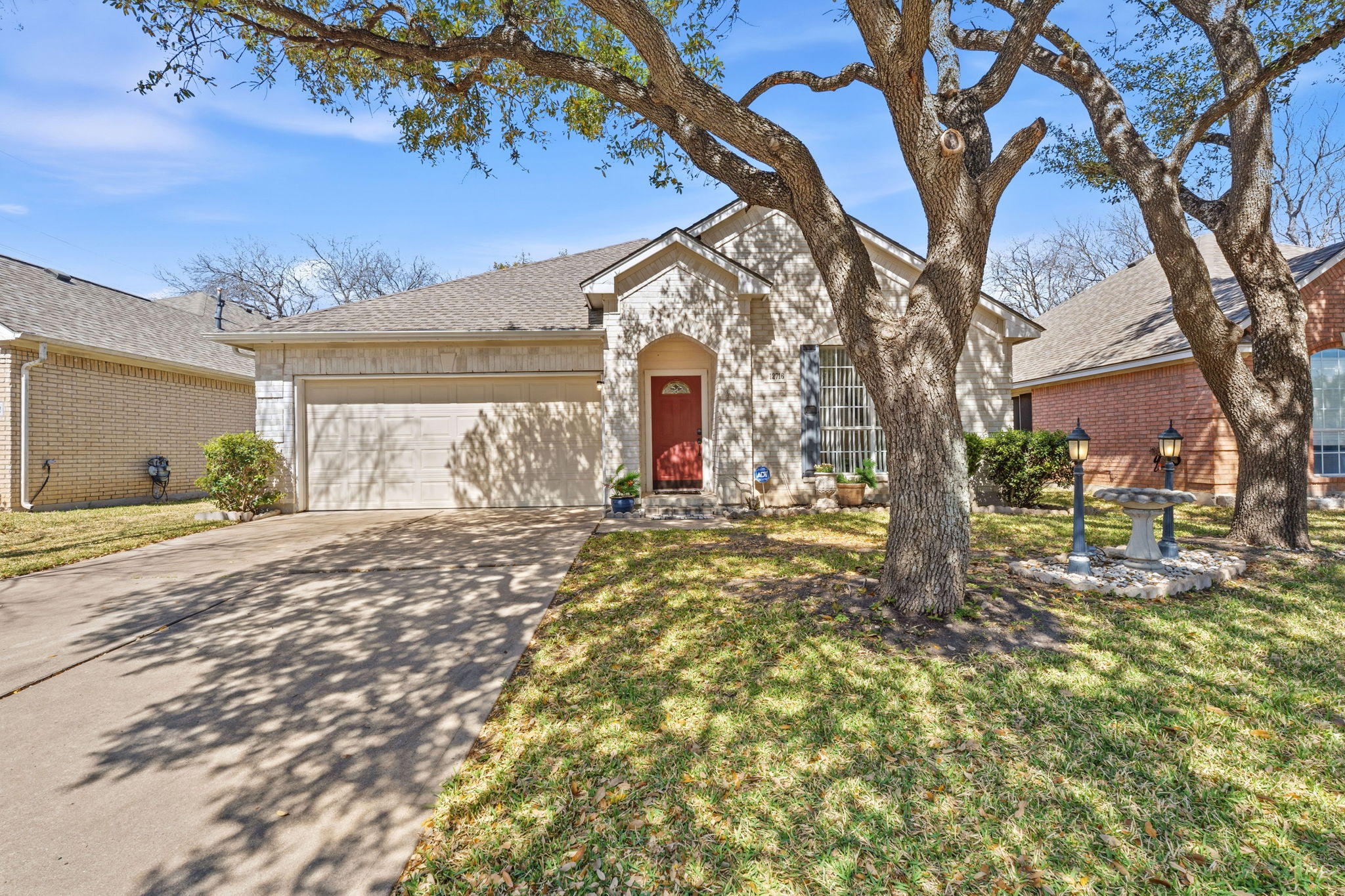 12716 Withers Way Austin, TX 78727 - Photo 2 of 29 a large tree in the middle of a yard