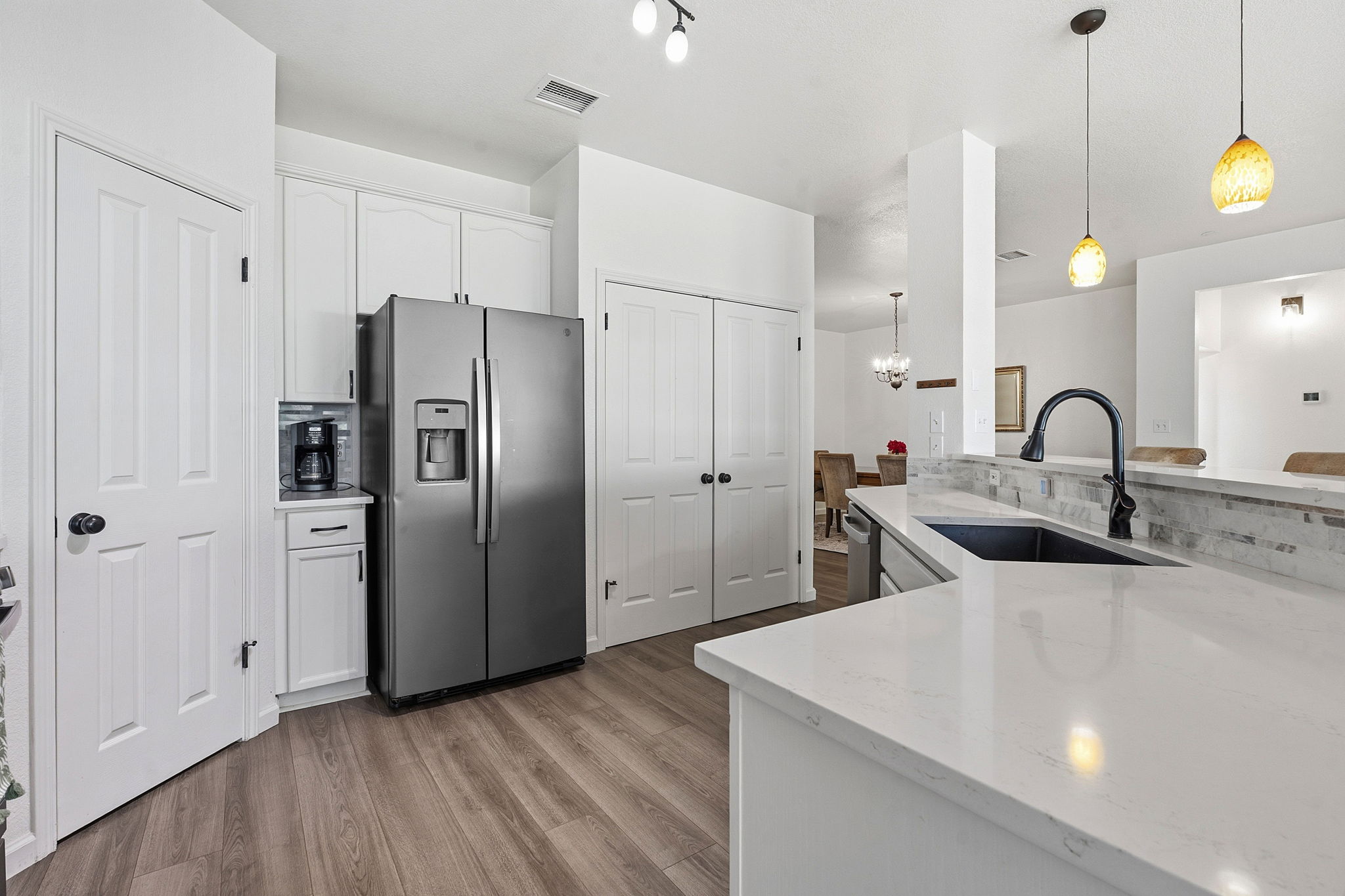 12716 Withers Way Austin, TX 78727 - Photo 7 of 29 a kitchen with stainless steel appliances a refrigerator and a sink