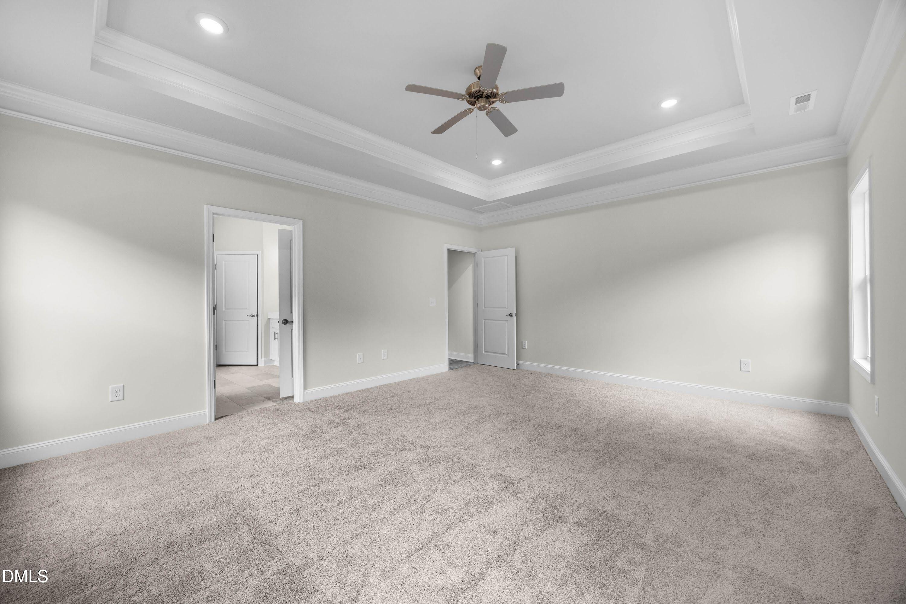 227 Galway Road Lillington, NC 27546 - Photo 19 of 36 a view of an empty room with a ceiling fan