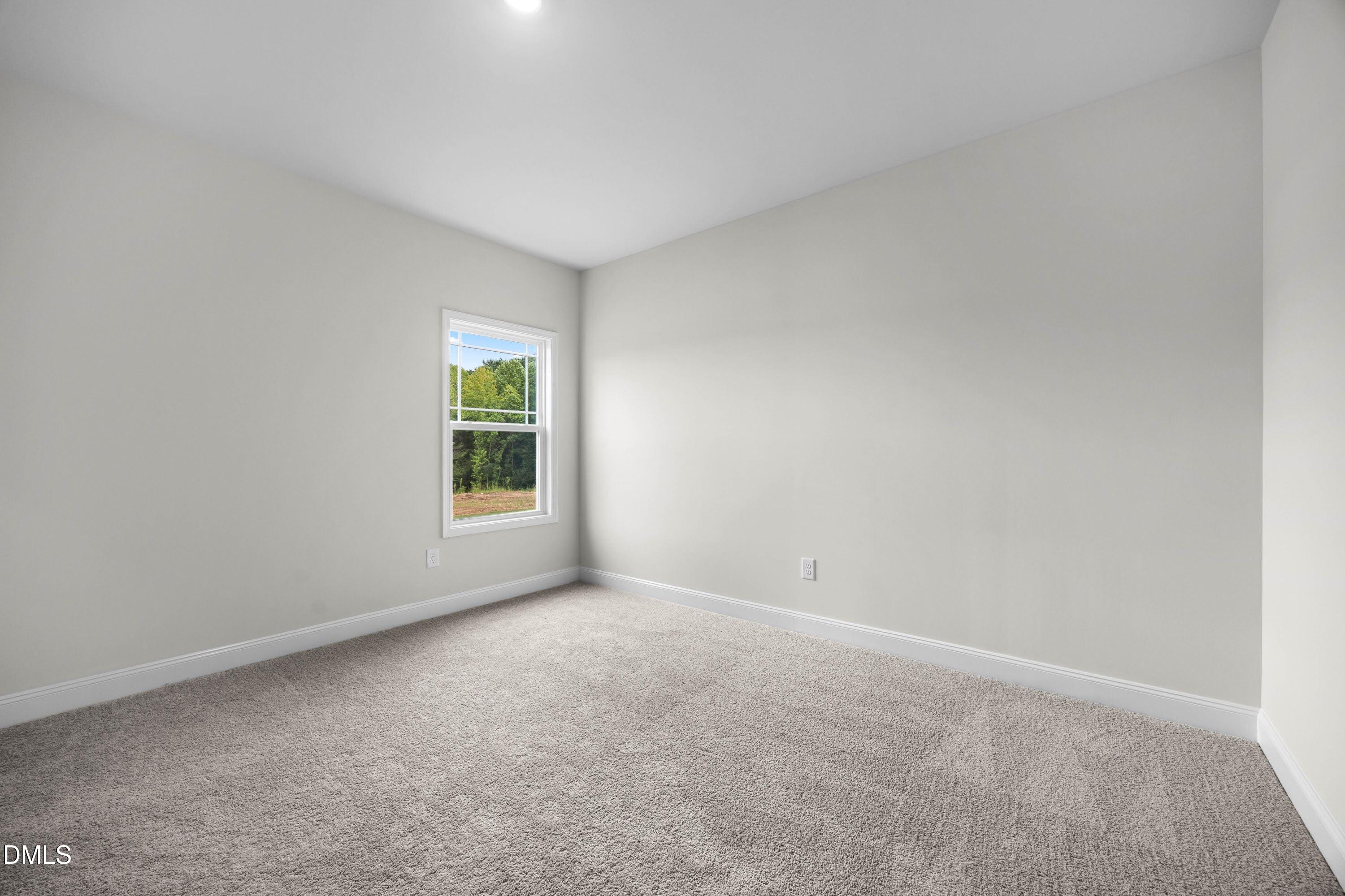 227 Galway Road Lillington, NC 27546 - Photo 25 of 36 a view of an empty room with a window